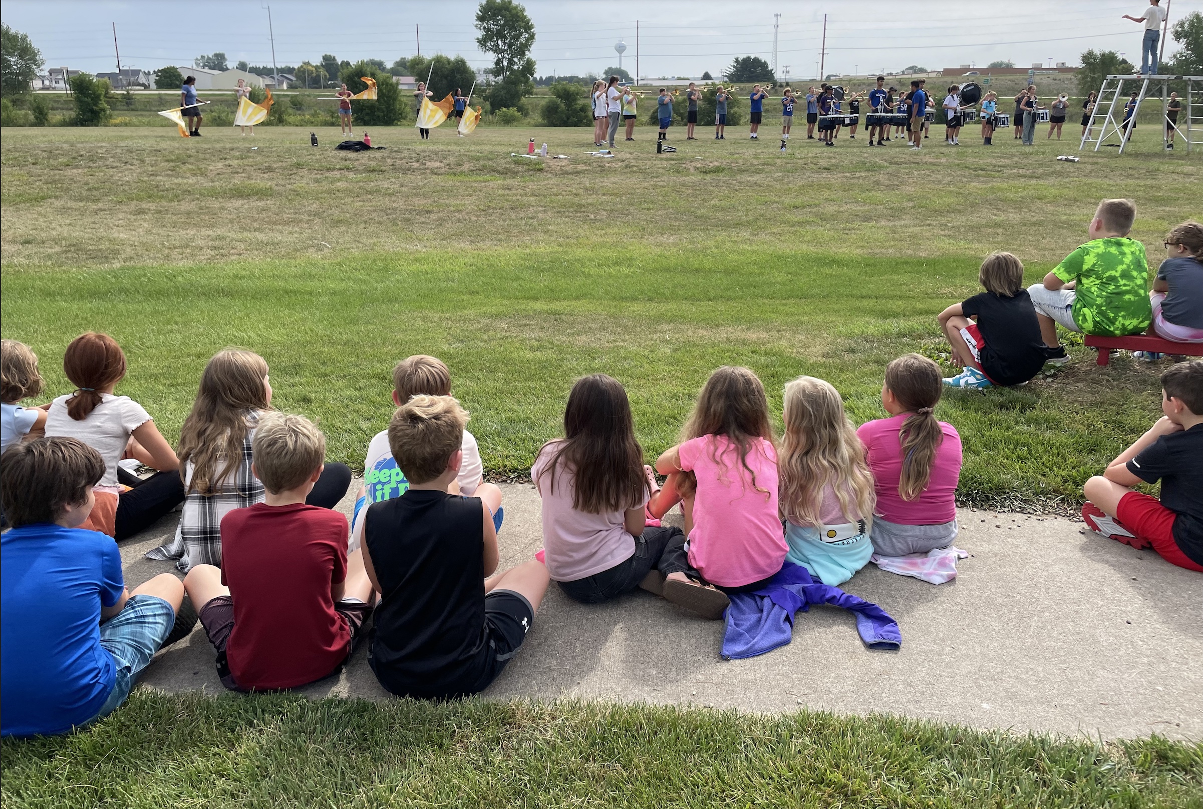 3rd Graders watching marching band